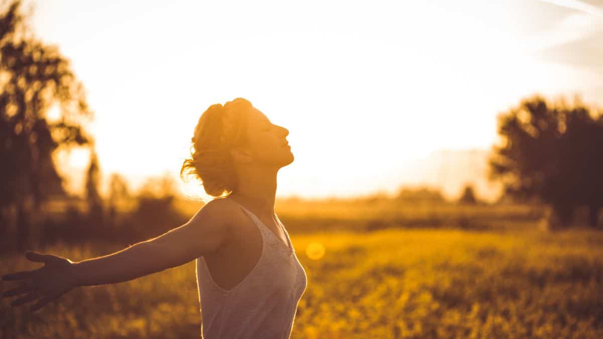 A woman who is practicing a breathing technique