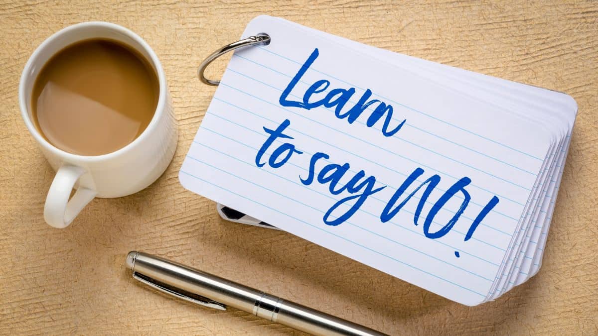 A card with a text “Learn to say no” written on it